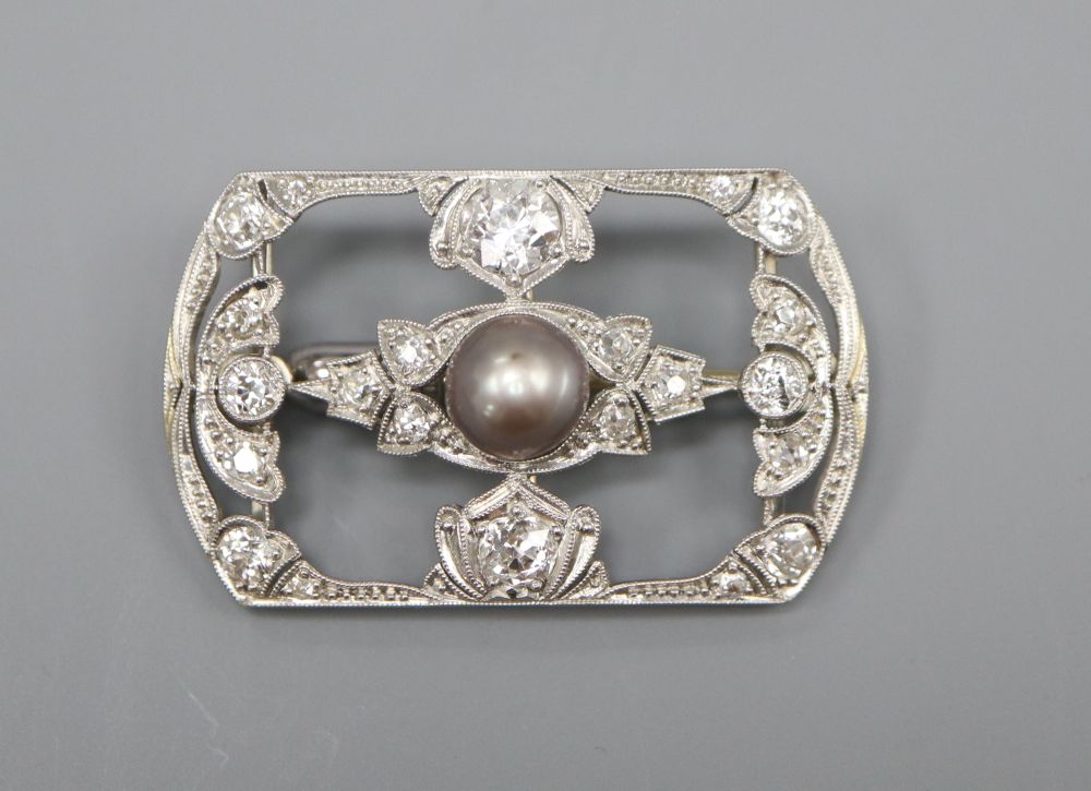 An early 20th century 18ct white gold diamond and pearl open plaque brooch, 3.25cm, gross 5.7 grams